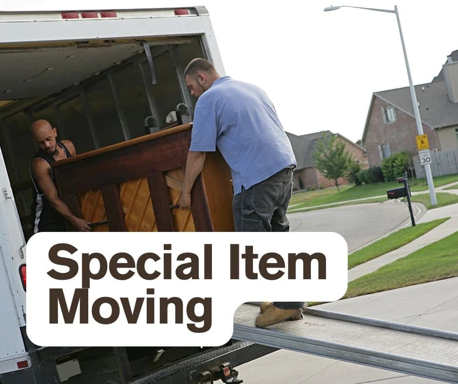 Movers loading an upright piano into a truck for specialty item moving in Salt Lake City