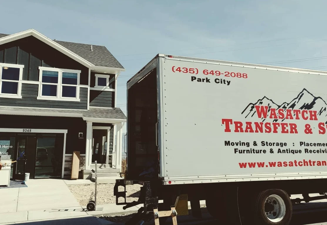 Wasatch Transfer moving truck outside a home for moving and storage service in Salt Lake City