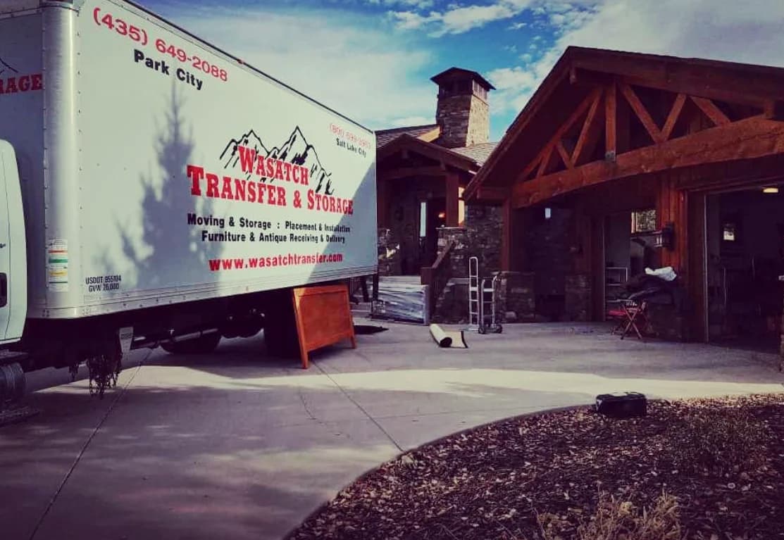 Wasatch Transfer moving truck and crew unloading at a property on a short-notice move